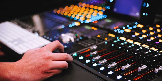 Hand mixing sound panel - audio engineering